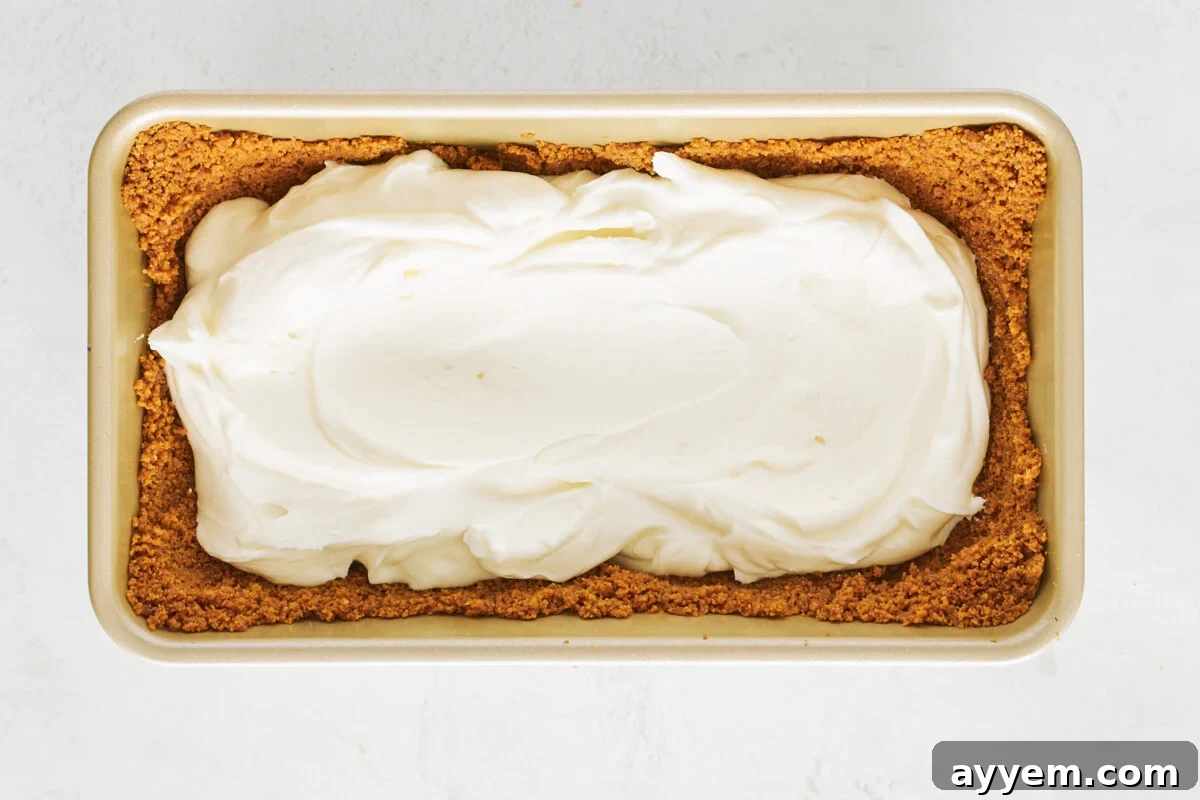 Cream cheese filling in a Biscoff cookie crust in a loaf pan.