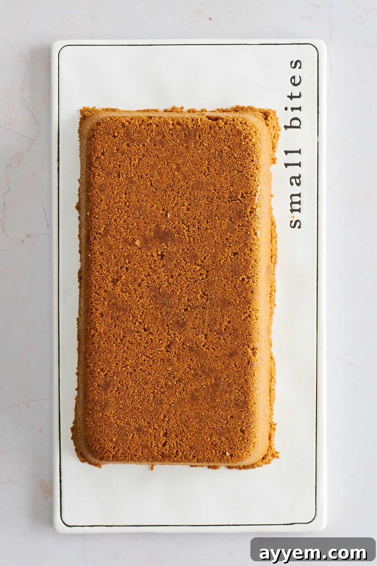 No-bake upside-down cheesecake inverted onto a plate, ready to serve.