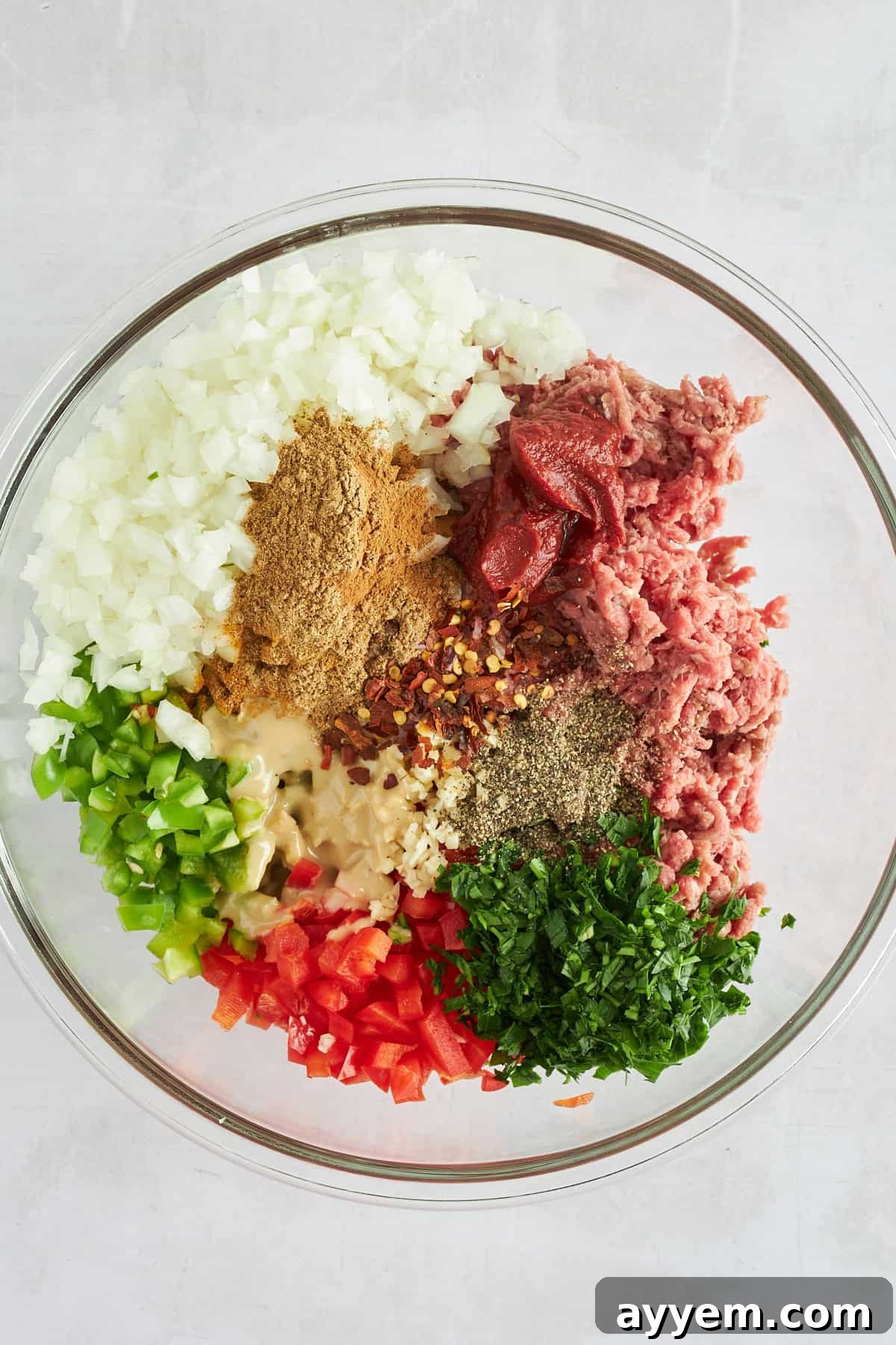 Hawawshi ingredients in a bowl, before mixing.