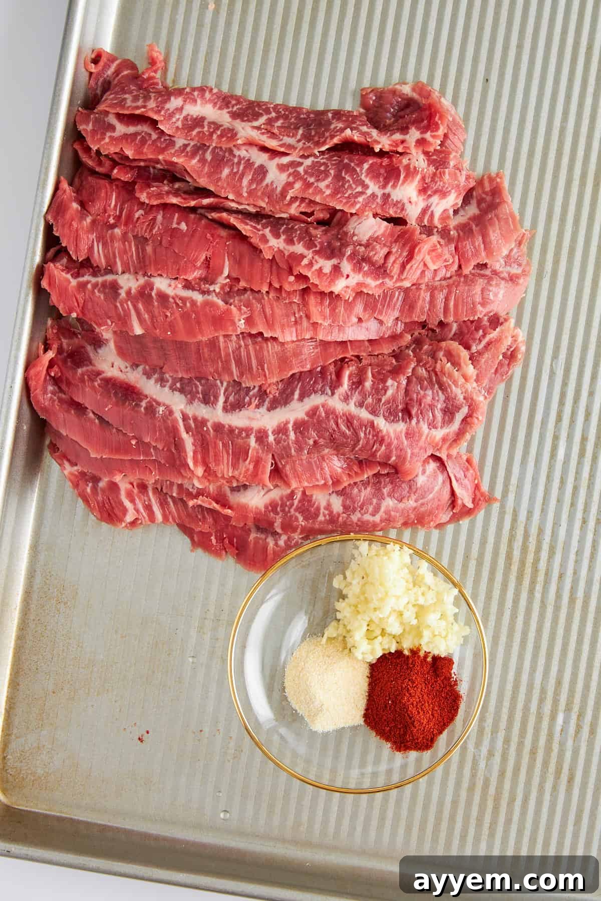 Steak strips on a baking sheet. 