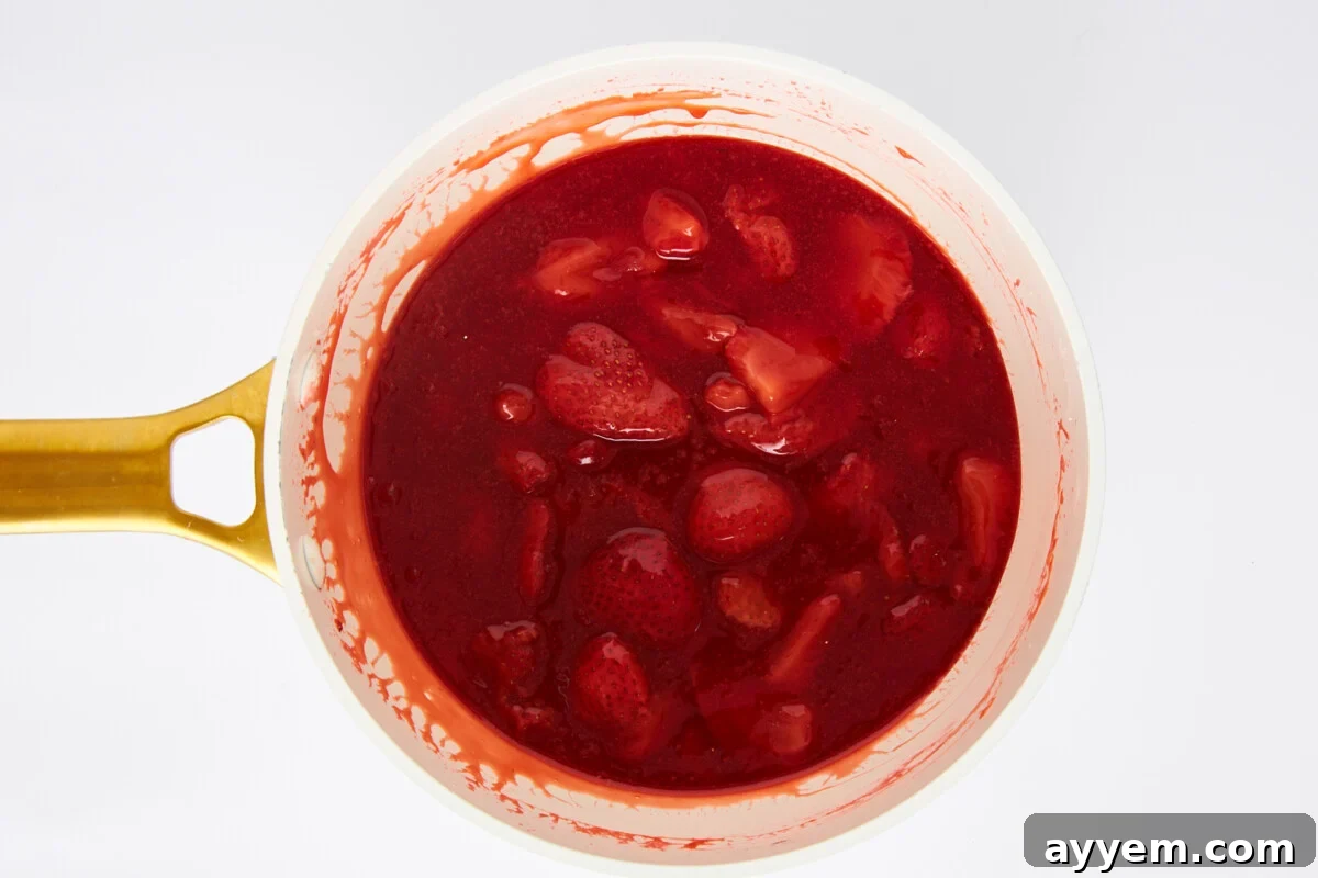 Strawberry sauce in a saucepan.