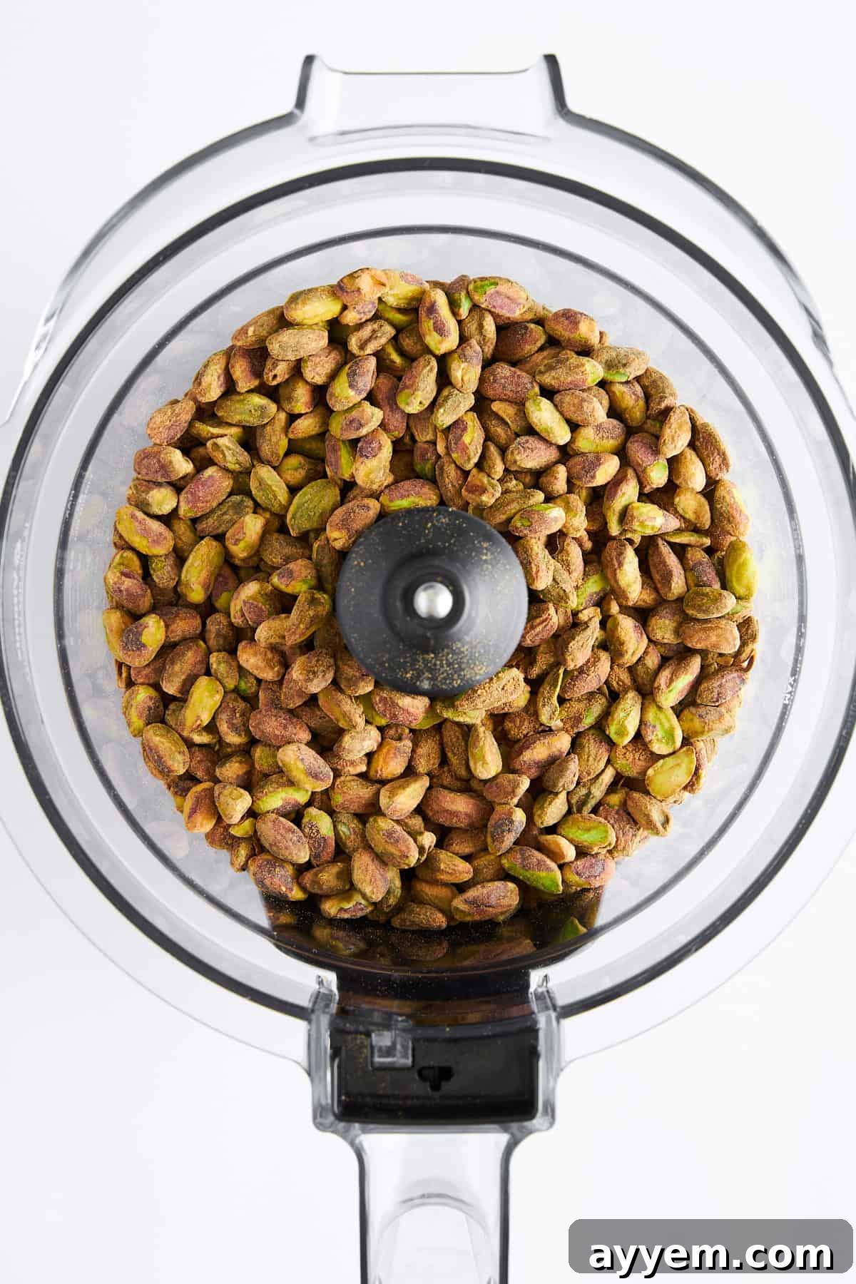 Shelled pistachios in a food processor. 
