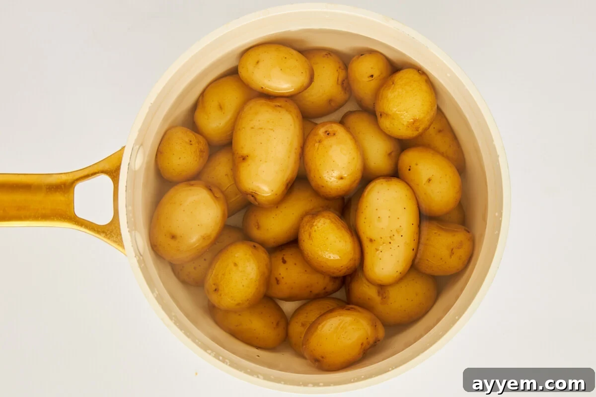 Potatoes boiling in a pot.