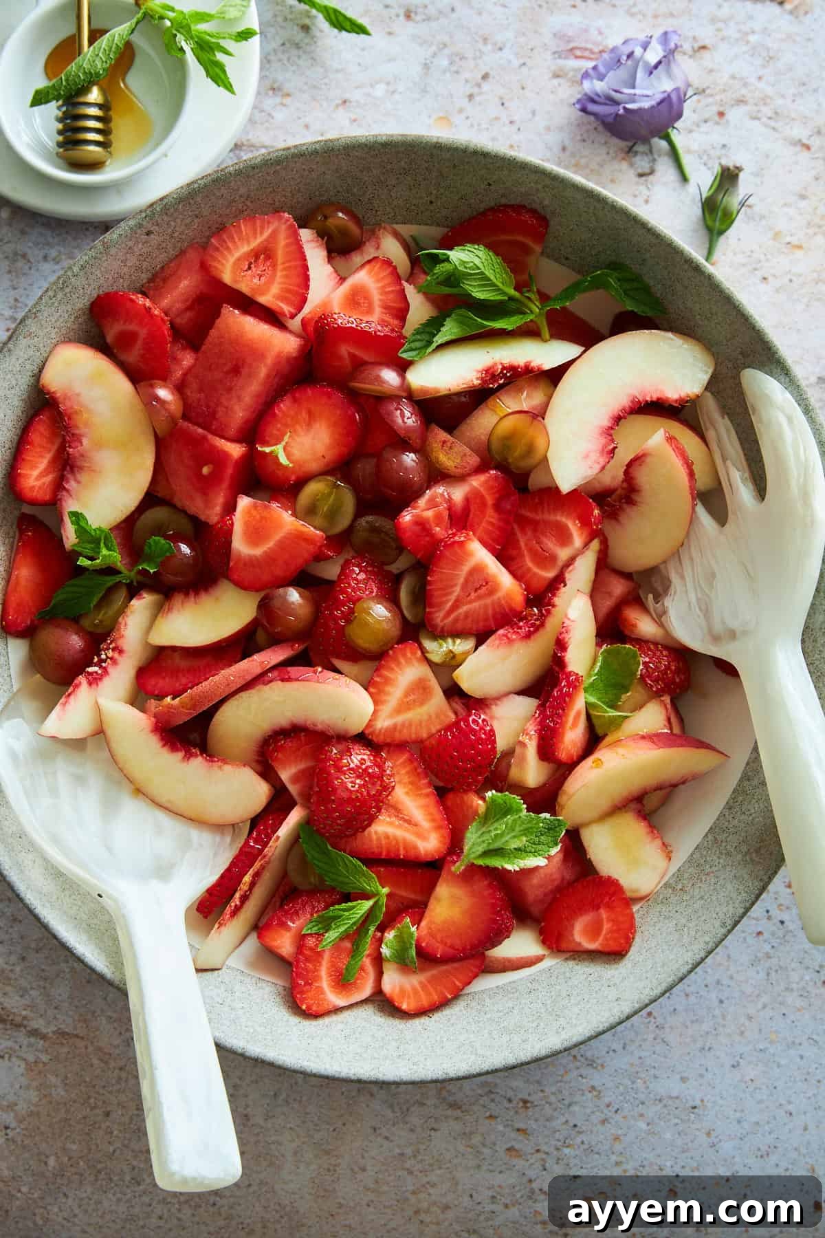 A bowl of peach watermelon salad, ready to be served.