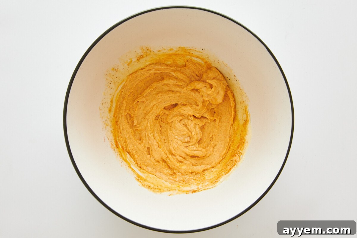 Hummus marinade mixed in a bowl, ready for chicken.