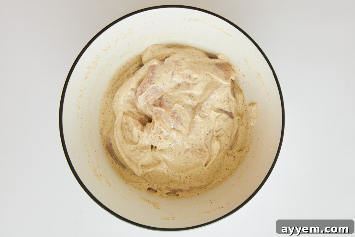 Raw chicken in tahini yogurt marinade.