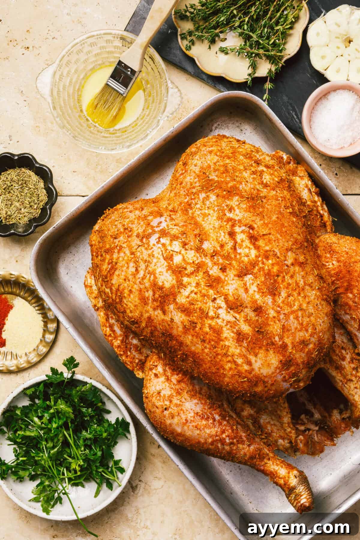 Close-up of golden turkey skin with herbs.