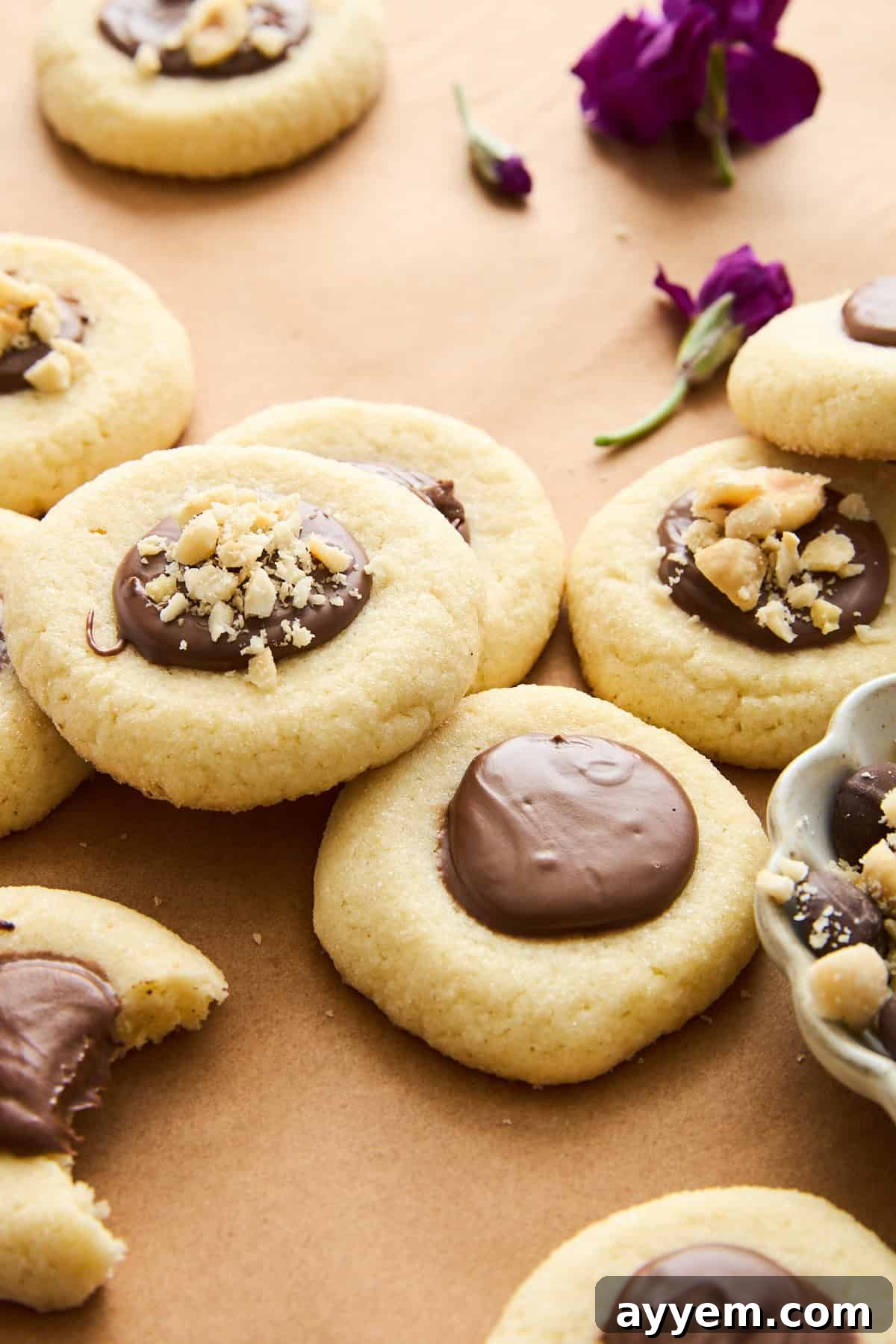 Delicious Nutella thumbprint cookies arranged on a cooling rack.