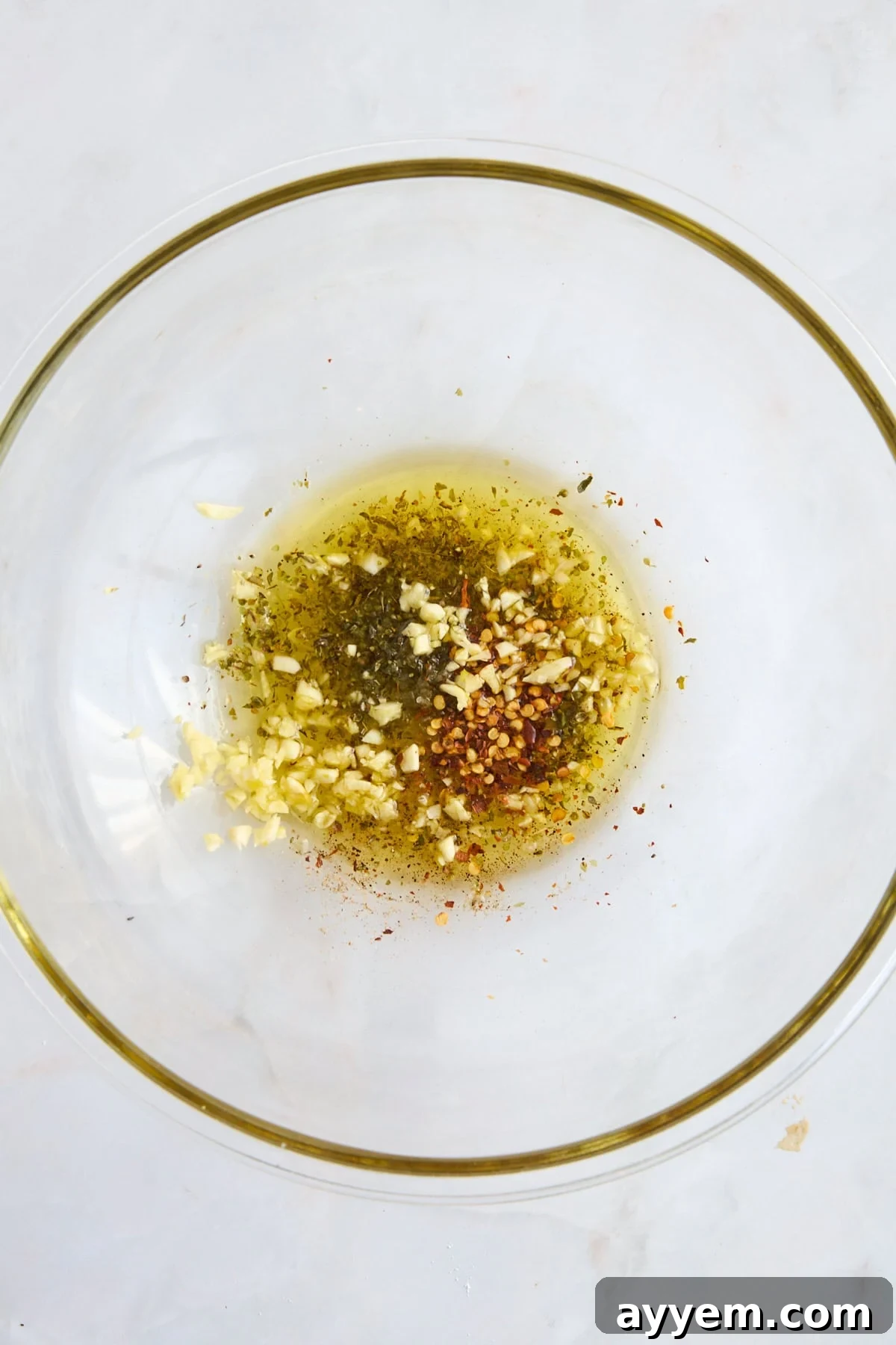 Olive oil and spices in a bowl. 