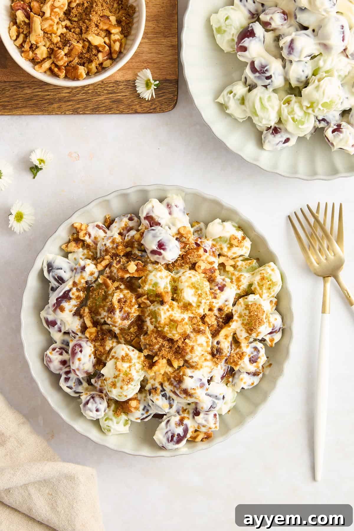 A bowl of Mediterranean-inspired grape salad with a walnut topping, ready to be served.