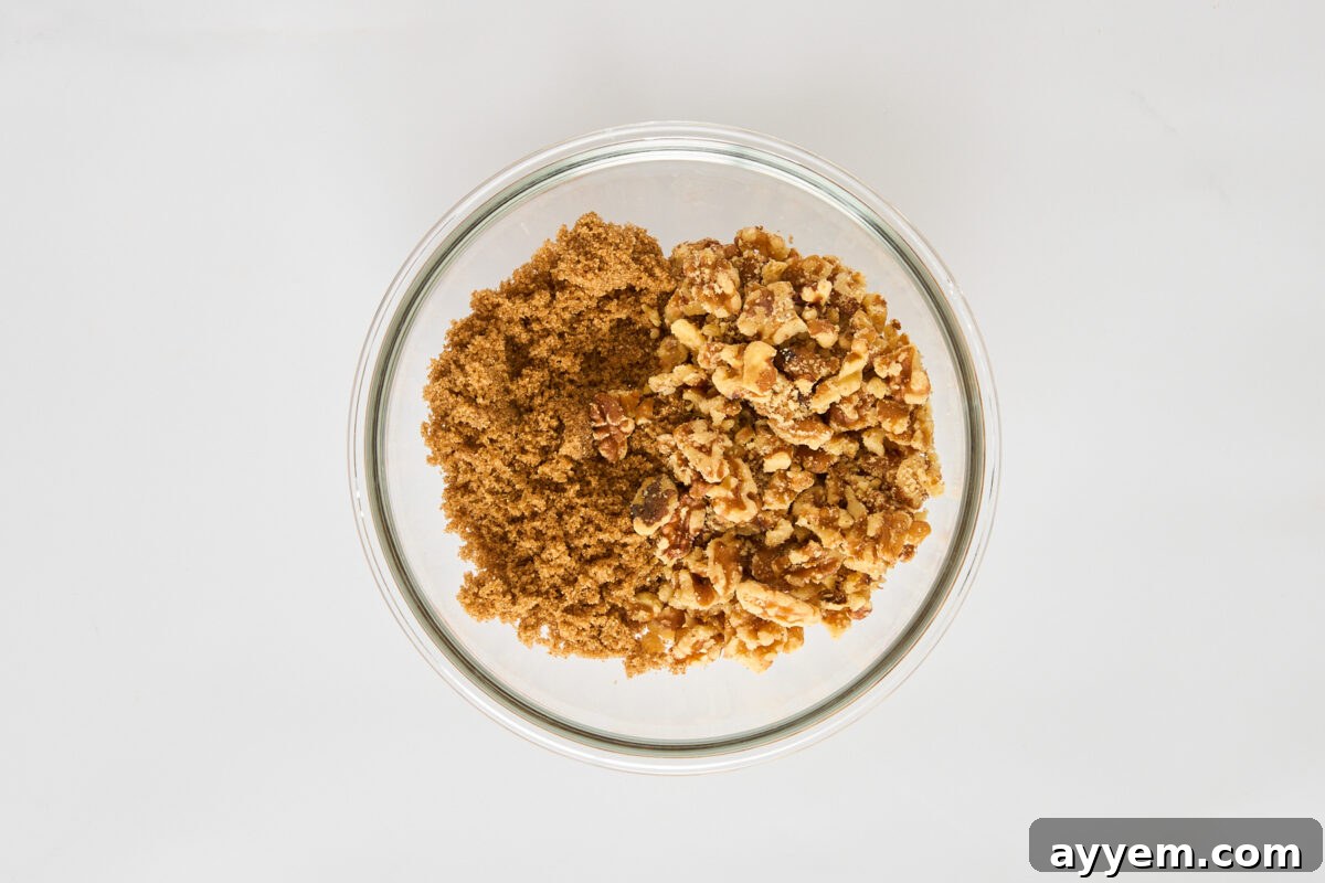 A brown sugar and walnut topping in a bowl.