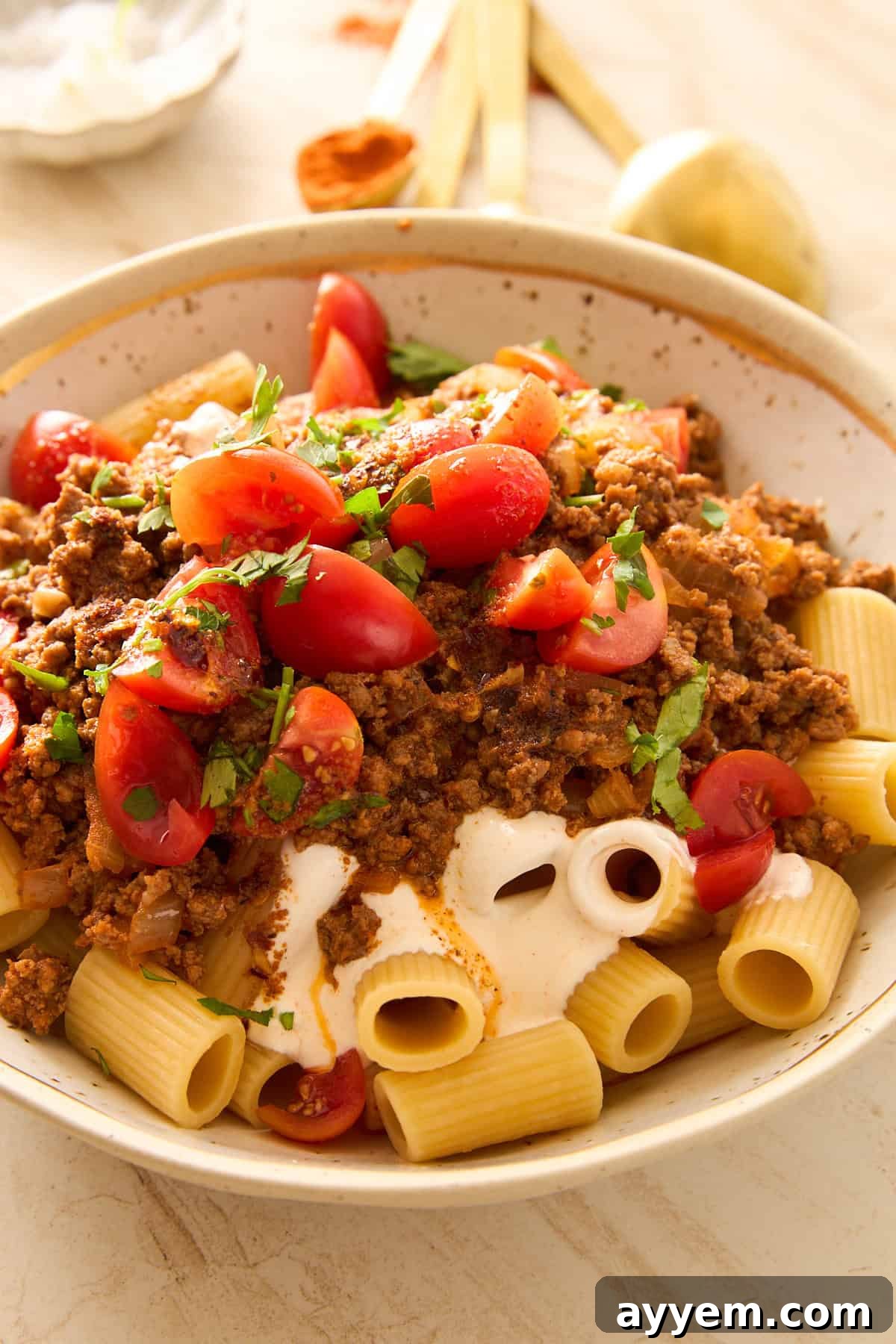 A bowl of Turkish pasta with garlic yogurt and spiced butter, ready to be served.