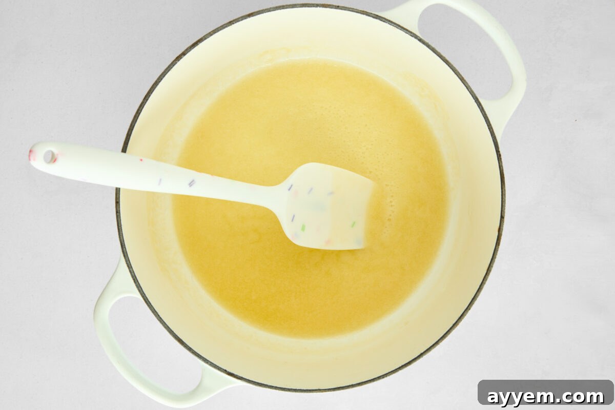Unsalted butter melting in a skillet before flour is added.
