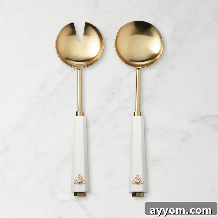 Crafting the Perfect Influencer Box: Our Secrets Revealed 6 A set of two golden salad servers on a marble surface.