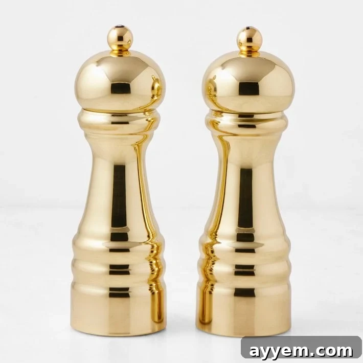 Crafting the Perfect Influencer Box: Our Secrets Revealed 7 A pair of shiny gold salt and pepper mills.