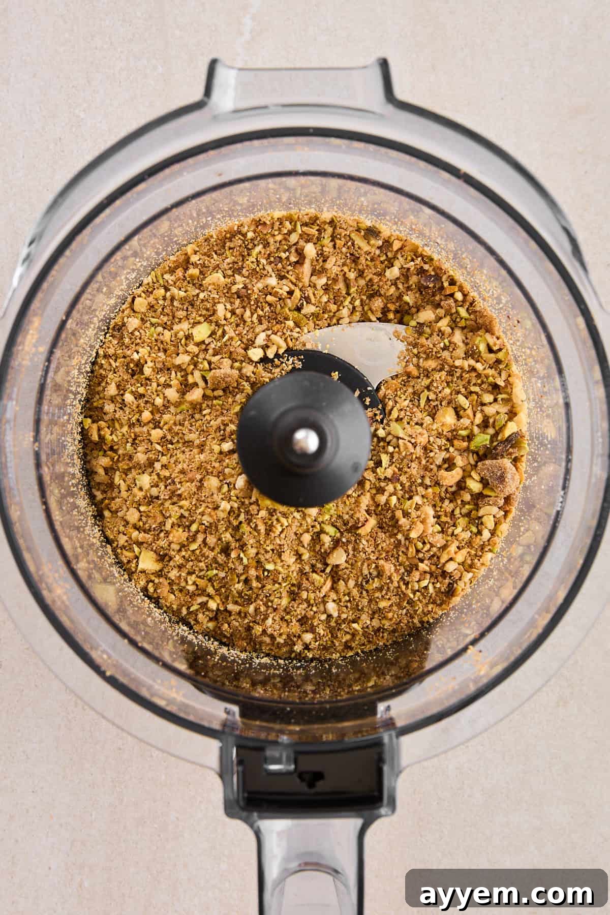 A bowl of sweet, spiced nut mixture, ready to be sprinkled onto the focaccia dough.