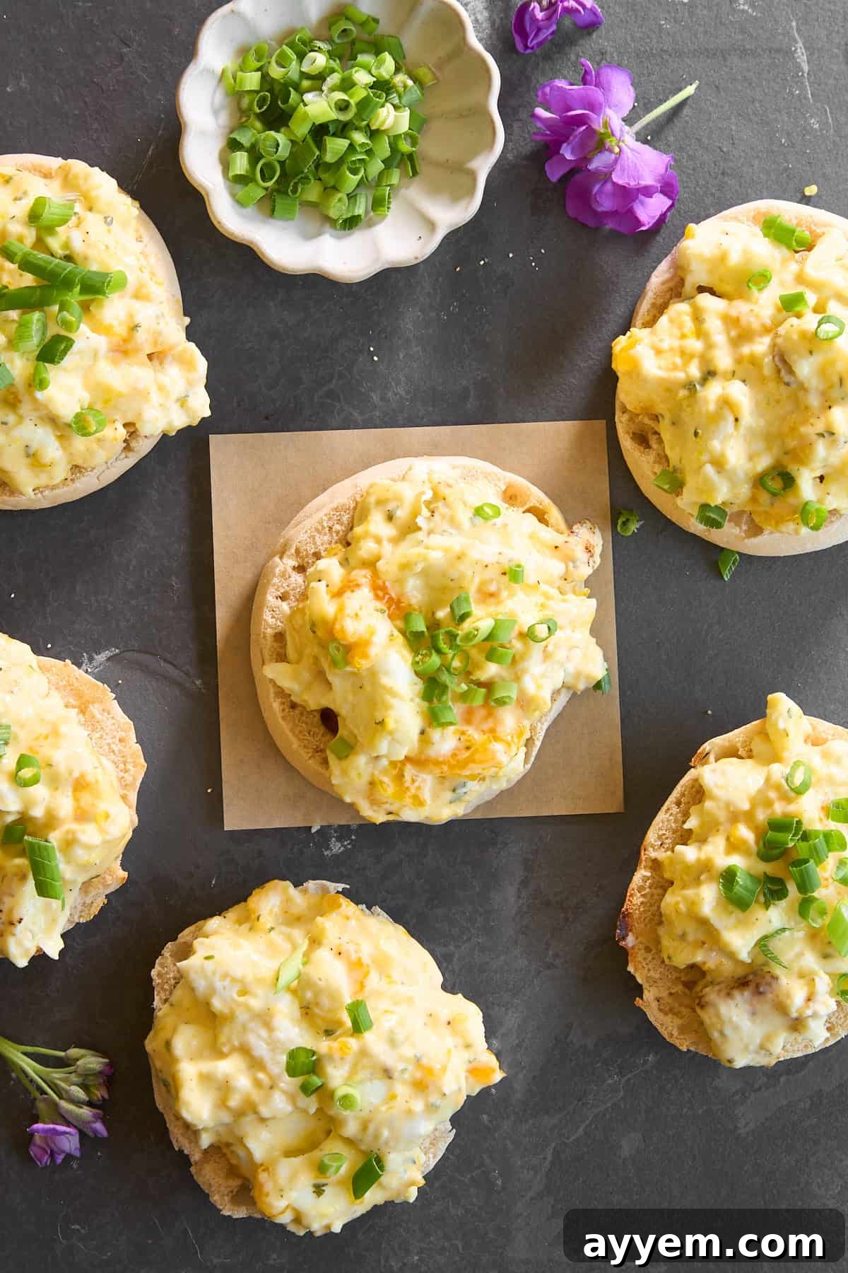 Baked scrambled eggs in a baking dish with Boursin cheese.