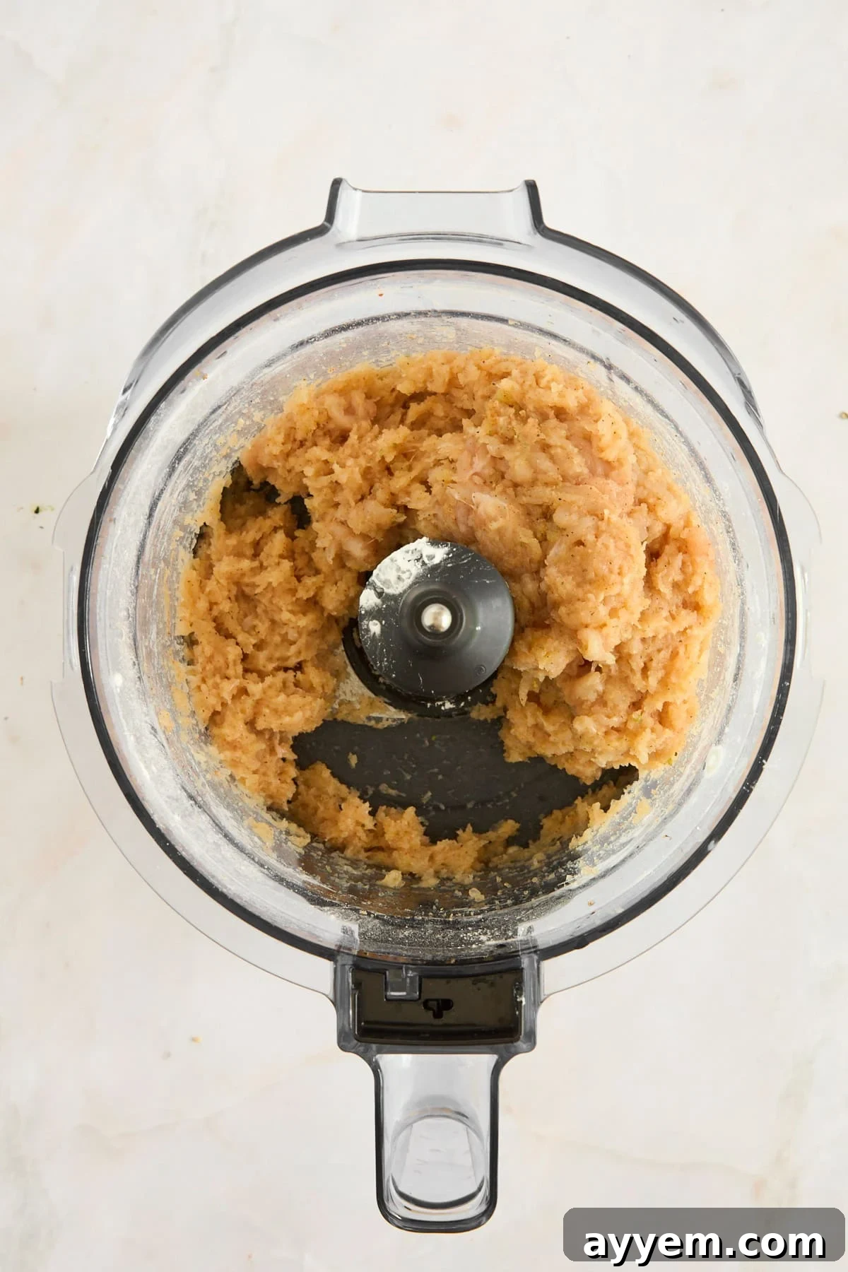 The chicken nugget mixture, finely processed to a uniform consistency in a food processor.