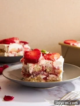 Slices of strawberry tiramisu on plates.