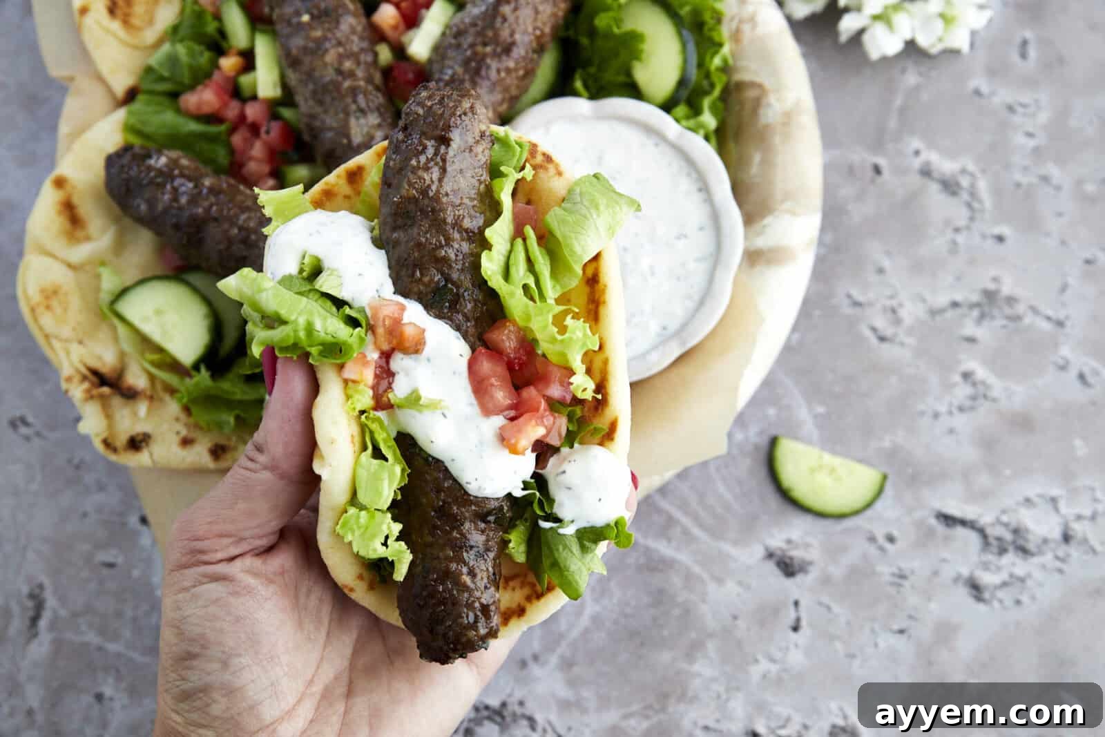 A savory pita pocket filled with perfectly grilled kofta, fresh vegetables, and a creamy sauce – a truly satisfying and ideal Ramadan recipe for Iftar.