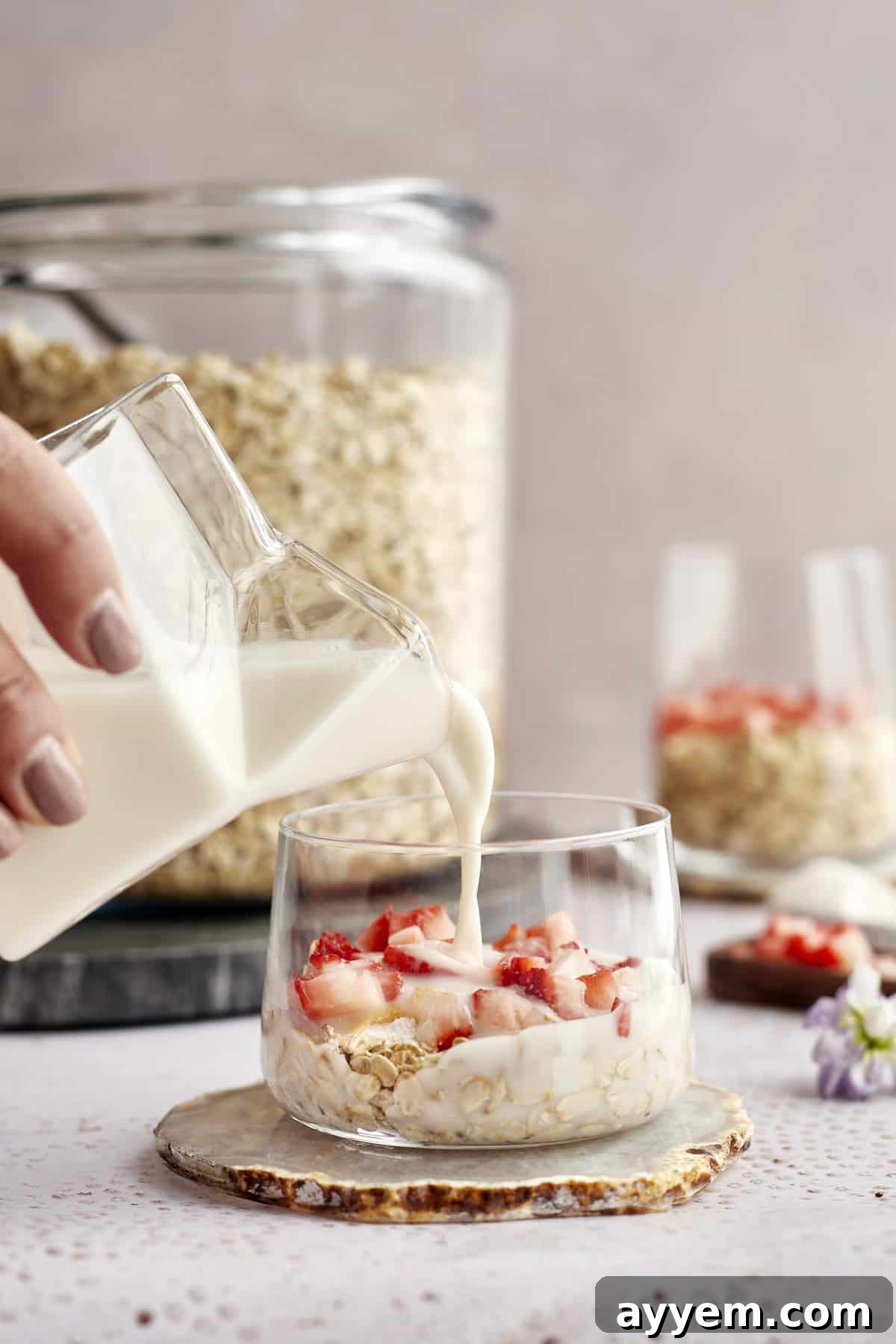 A bowl of overnight oats with strawberries, illustrating a creamy dish